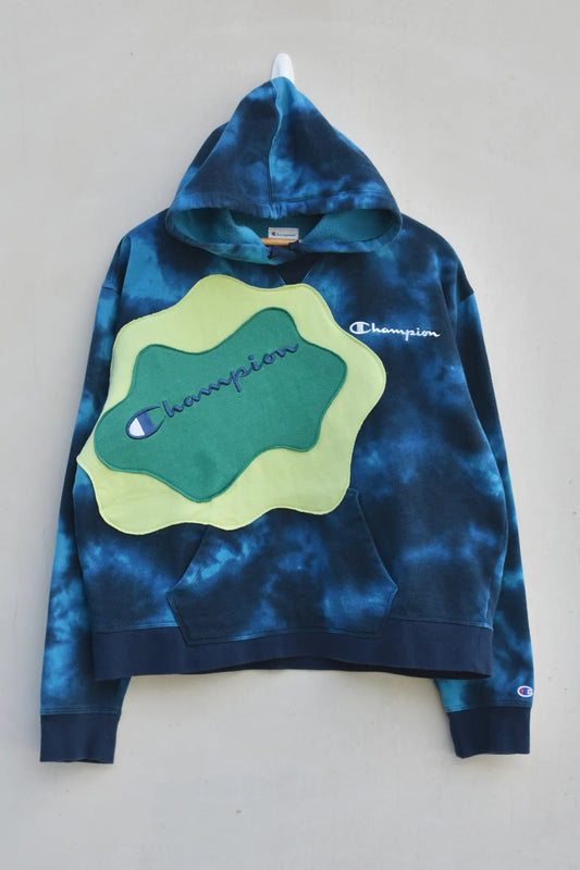 MEZOTER “Aqua Vibe” Champion Hoodie – Blue Tie-Dye Hoodie with Green Patch Design