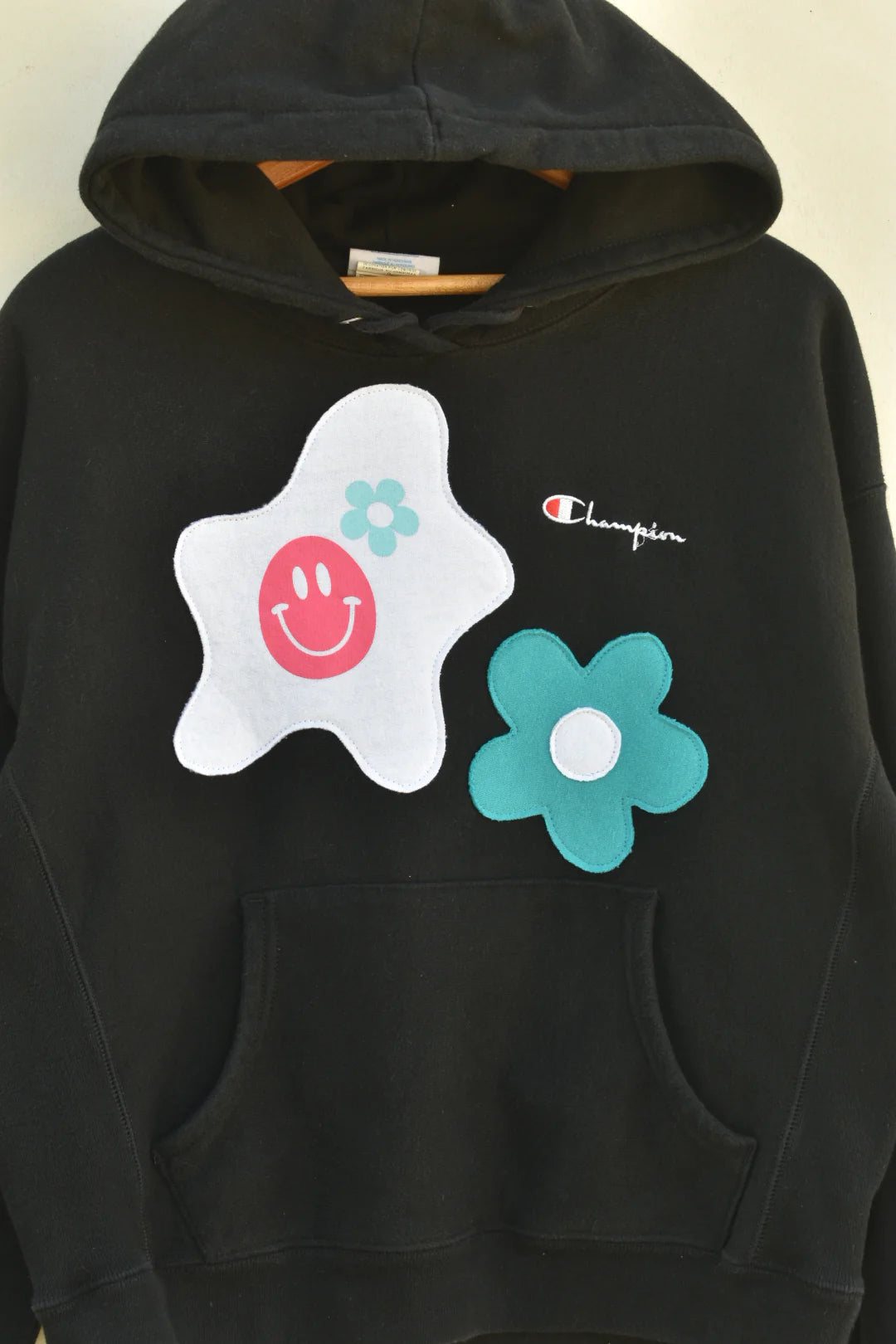 MEZOTER “Happy Bloom” Hoodie – Black Champion Hoodie with Smiley & Flower Patches